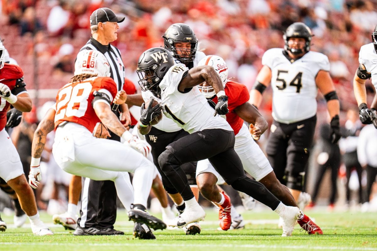 Demond Claiborne (1) tries to dash through the Stanford Cardinal defense. Claiborne had 127 yards on 23 carries. (Courtesy of Wake Forest Athletics)